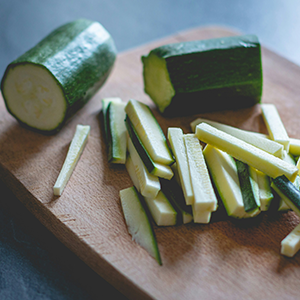 a chopped-up zucchini on a cutting board